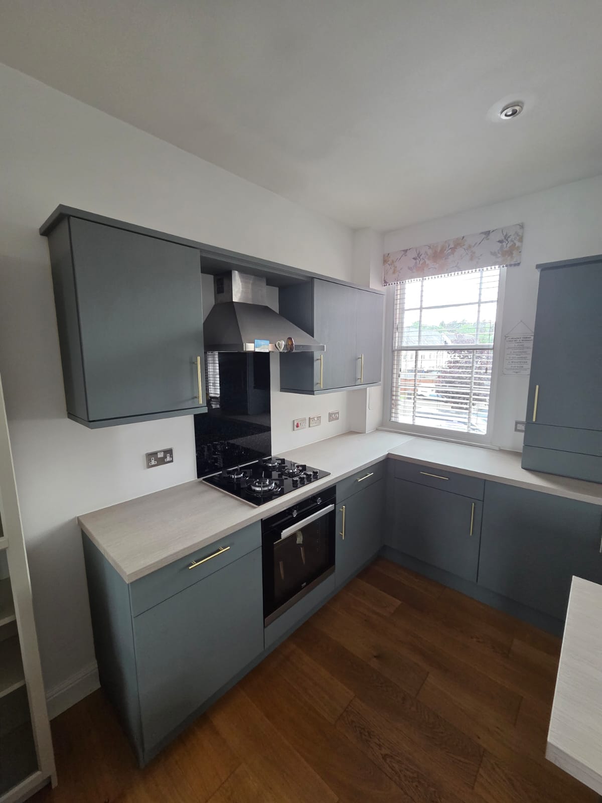 Same run resurfaced in petrol blue with brass handles