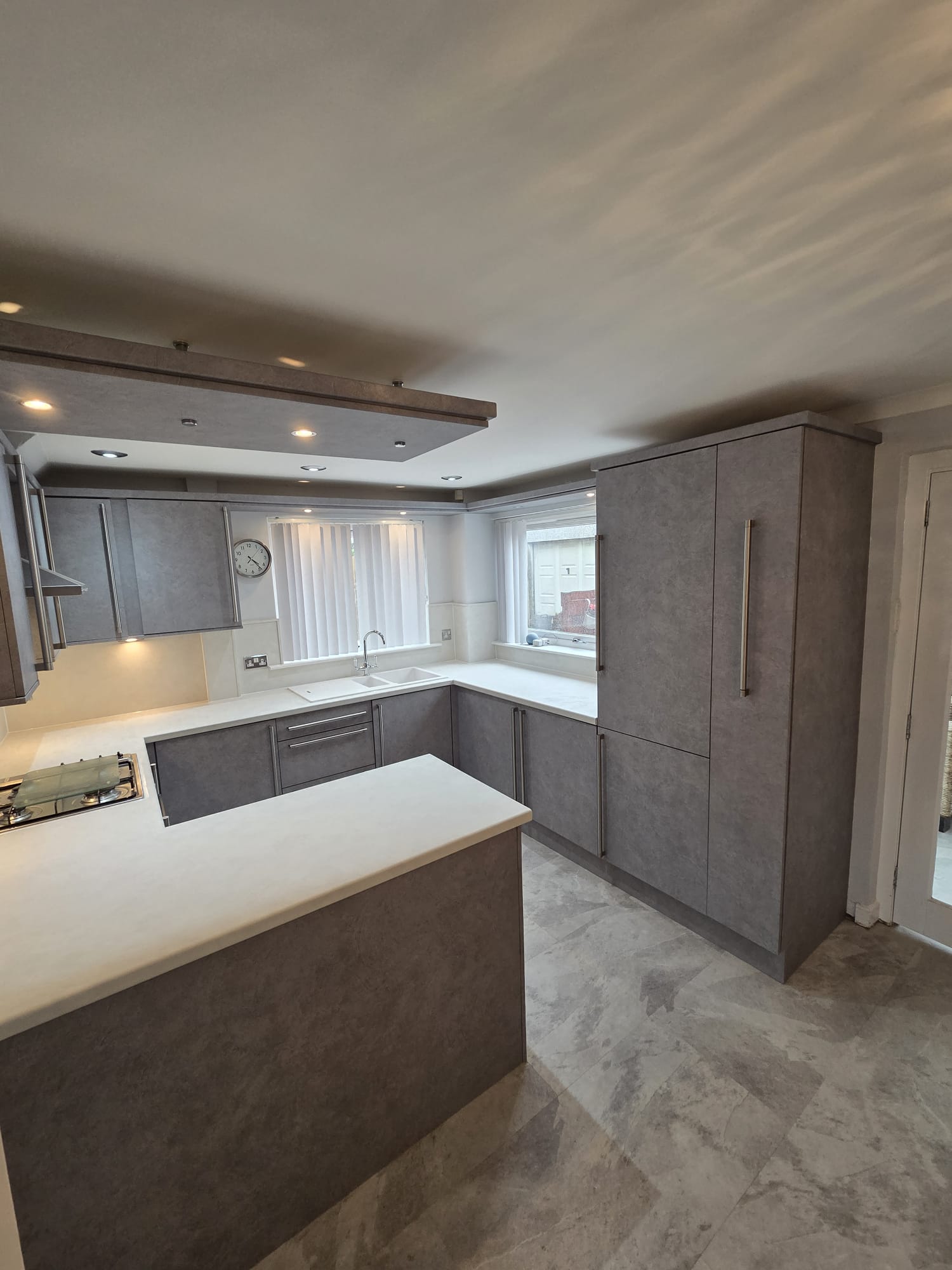 Same Glasgow kitchen resurfaced in concrete-effect grey